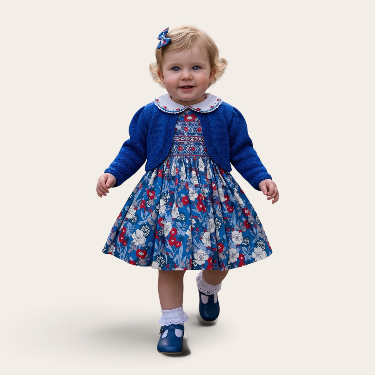 Blythe blue floral hand-smocked girls dress with Peter Pan collar and puff sleeves